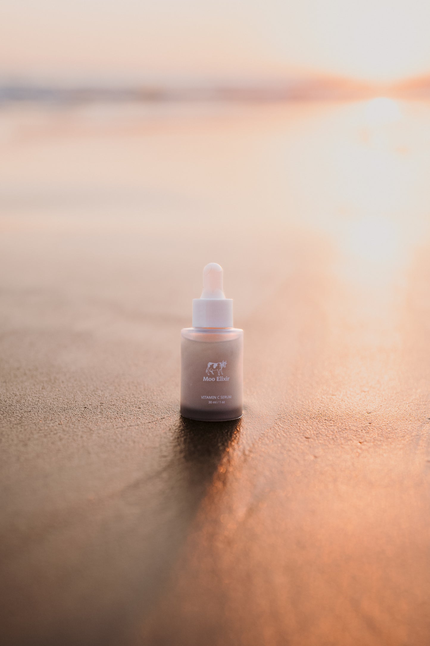 Moo Elixir product on beach